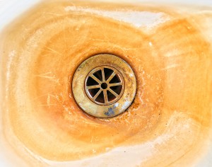 image from stained texture background series (old hard water or lime stained sink drain)